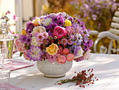 Round bouquet of Aster (autumn asters), Rosa (roses, rose hips), Dahlia