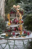 Decorated etagere christmasy with red balls, orange slices