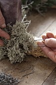 Natural advent wreath with black dates and reindeer lichen (4/5)