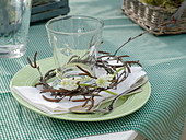 Glass in a wreath of Betula (birch twigs) decorated with Muscari