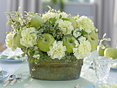 Green and white bouquet with green apples (Malus), Dianthus (carnation)