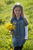 Girl with bouquet of buttercups