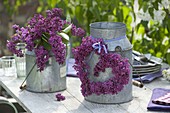 Heart and syringa (lilac) bouquet in old zinc cans