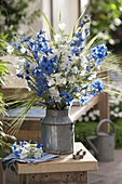 Blue and white bouquet in old zinc pot