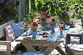 Bavarian table decoration with cereals and geraniums