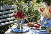 Bavarian table decoration with cereals and geraniums