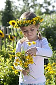 Girl with Anthemis tinctoria bouquet and wreath
