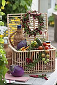 Gift basket with vegetables, herbs and preserves
