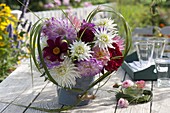 Dahlia bouquet framed by heart of miscanthus