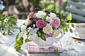 Bouquet of tea herbs: Humulus (hops), Rosa (roses), elderberries