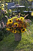 Colourful cottage garden bouquet: Helianthus (sunflowers), Helenium