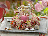 Canning jar with a wreath of hydrangea (hydrangea) and pink