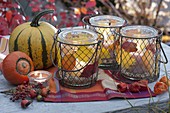 Canning jars in wire baskets as lanterns