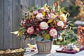 Autumn bouquet with Rose, cotoneaster with berries