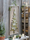 Homemade mural made of lichen-covered branches