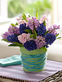 Scented bouquet of Hyacinthus (Hyacinths) in a vase covered with felt