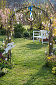 Rose arch with eggs, wreath of Salix (willow) and wooden Easter bunny