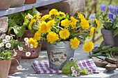 Small meadow bouquet made of taraxacum (dandelion) in a zinc cups