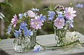 Small meadow bouquets in glasses