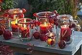 Old preserving jars as lanterns with home-made lanterns made from candle remains