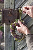 Small heather wreath with Chinese reed as door wreath