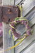 Small heather wreath with Chinese reed as door wreath