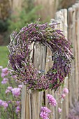 Wreath of Calluna vulgaris (Flowering broom heather) on fence