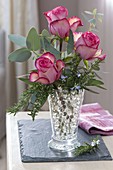 Small scented bouquet with Rosa (roses), Rosmarinus (rosemary) and Eucalyptus