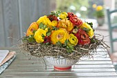 Round bouquet of ranunculus (buttercups) in wreath
