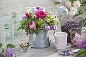 Herb bouquet in zinc pot: Rosa (roses), Syringa (lilac), Alchemilla