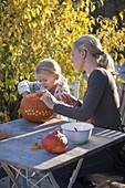 Pumpkins carve with children
