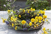 Tendrils wreath decorated with Taraxacum, Ajuga