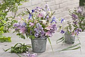 Blue-pink bouquet with aquilegia, syringa and grasses