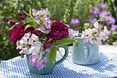 Bouquets of dark red rose and lathyrus latifolius