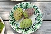 Fresh fruits of the prickly pear cactus (Opuntia ficus-indica) on ceramics