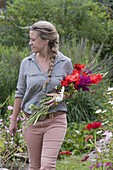 Woman with fresh cut flowers for bouquet