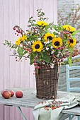 Bouquet from Helianthus, Symphoricarpos