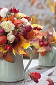 Autumn bouquet of Rose, physalis, malus