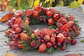 Autumn wreath made of physalis, malus, Rose