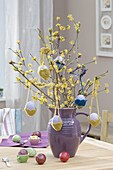 Easter bouquet of Cornus mas branches, easter eggs