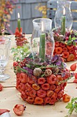 Pots with Lampion flowers stuck on as a decorative table decoration