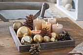 Simple Advent decoration with golden Christmas tree balls