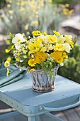 Yellow summer bouquet in basket vase, Achillea, Hemerocallis
