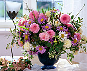 Bouquet of dahlias, bearded vetch, daisies, summer aster and pineapple mint