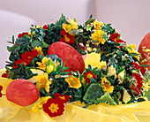 Wreath of primrose blossoms, ivy, box and ivy