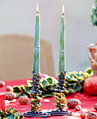 Candlestick decorated with holly leaves