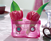 Tulip flowers in a lantern as a vase