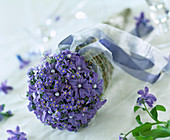 Bouquet in wicker bag in ball shape with hyacinth flowers