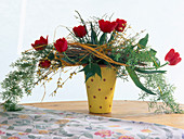 Bouquet with tulips and asparagus branch