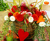 Wicker basket with dahlias and grasses